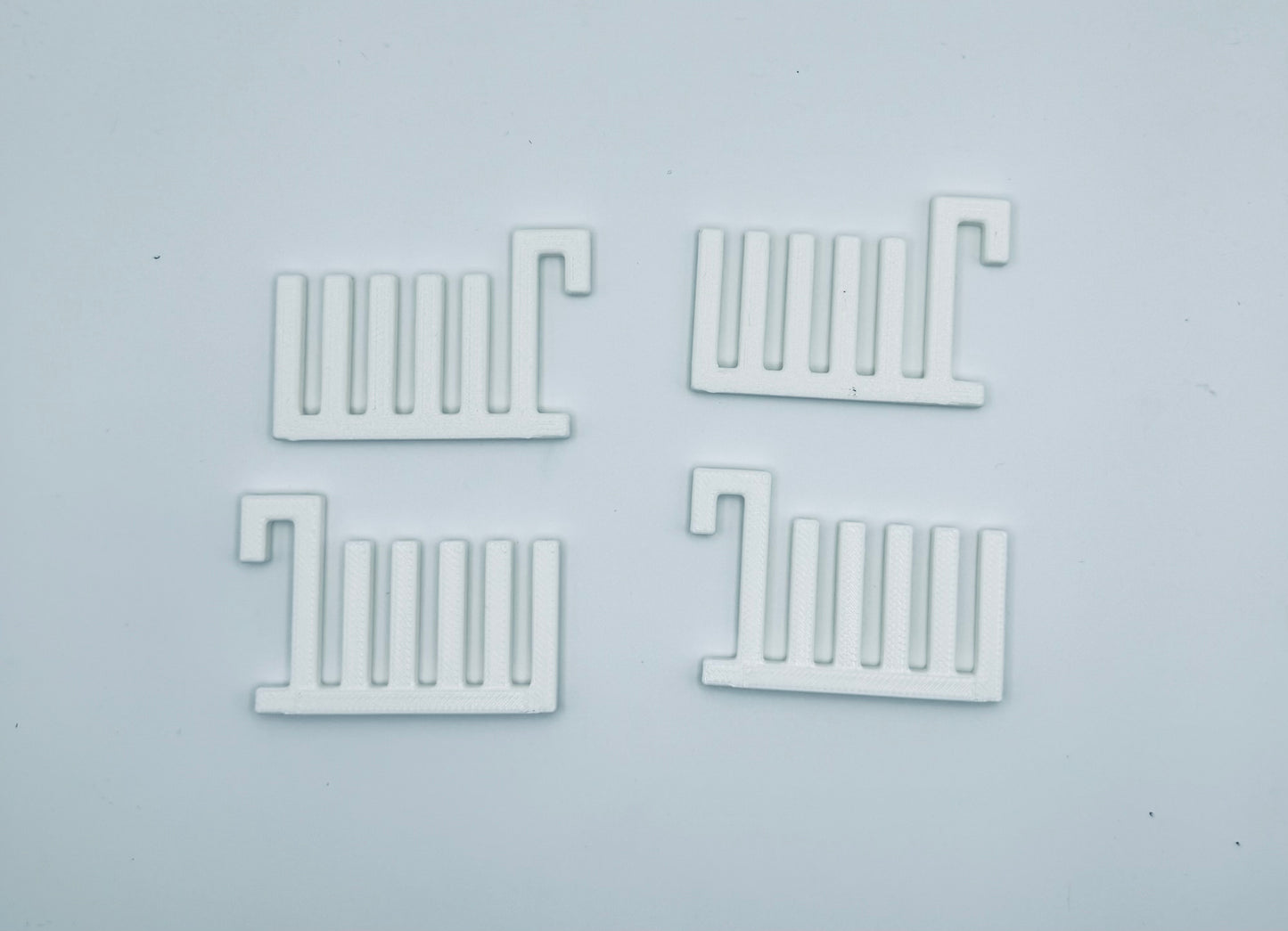 A 3D printed ruler holder for an Ikea Skadis pegboard. Perfect for quilting