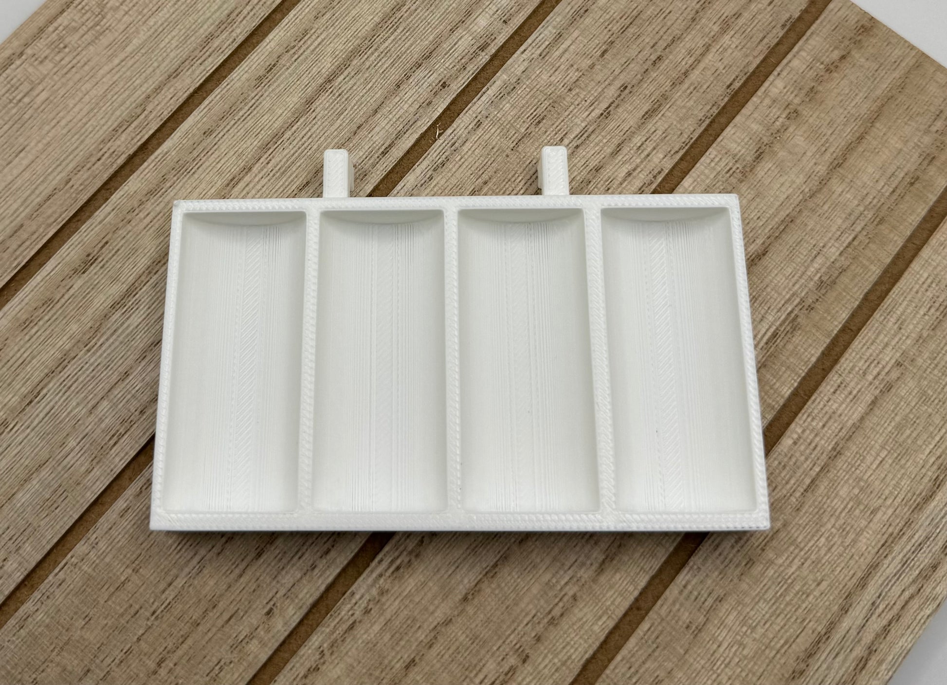 An empty Skadis Bobbin holder in white