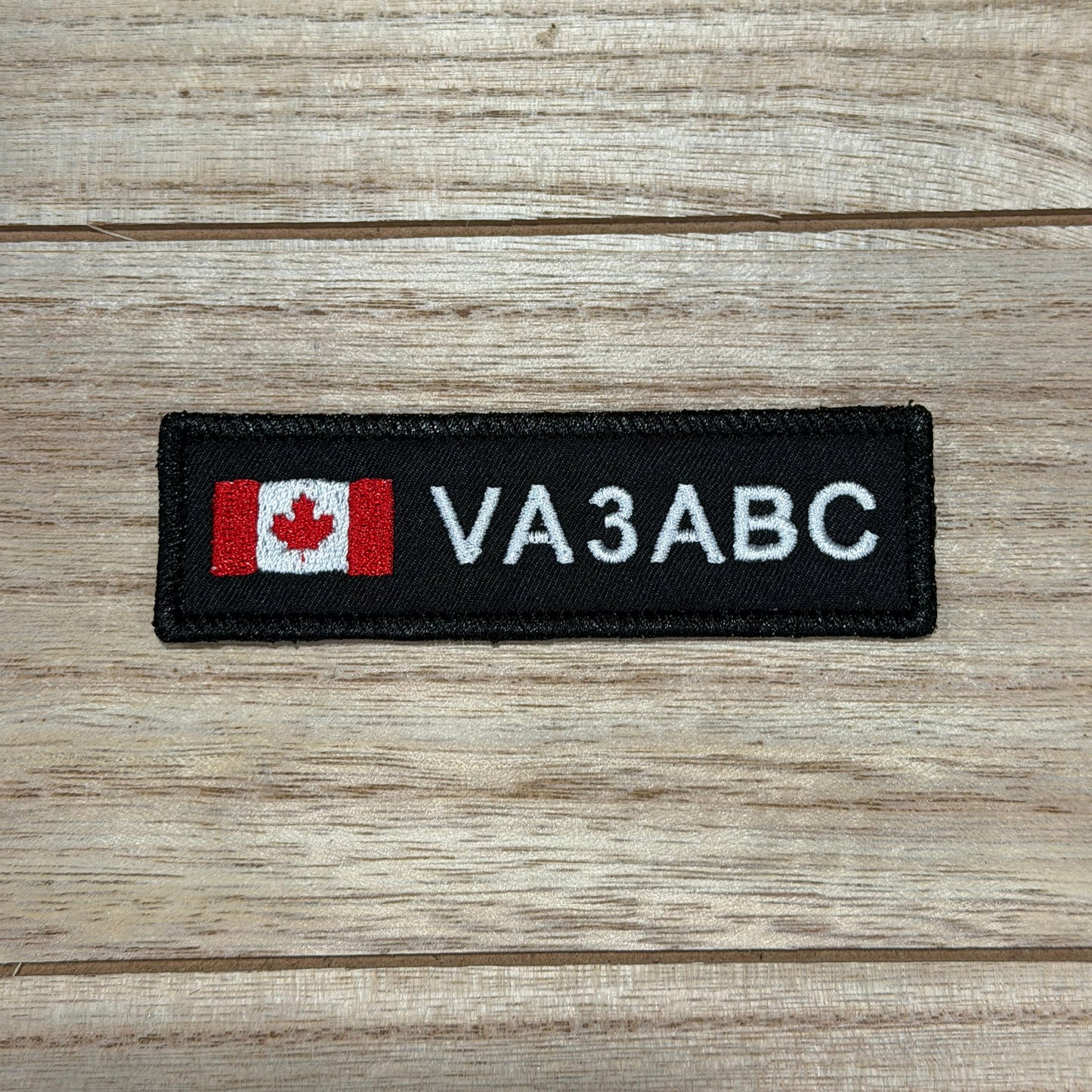 Ham Radio Patch Canadian flag on a wooden surface